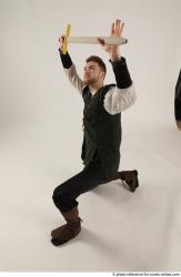 KEETA KNEELING POSE WITH SWORD